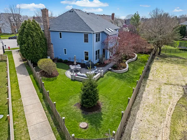 an aerial view of a house with outdoor space