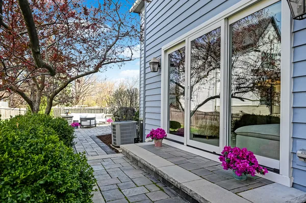 a view of a house with backyard and sitting area