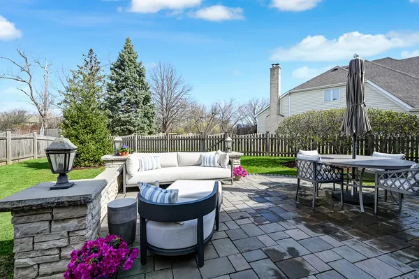an aerial view of house with yard swimming pool and ocean view