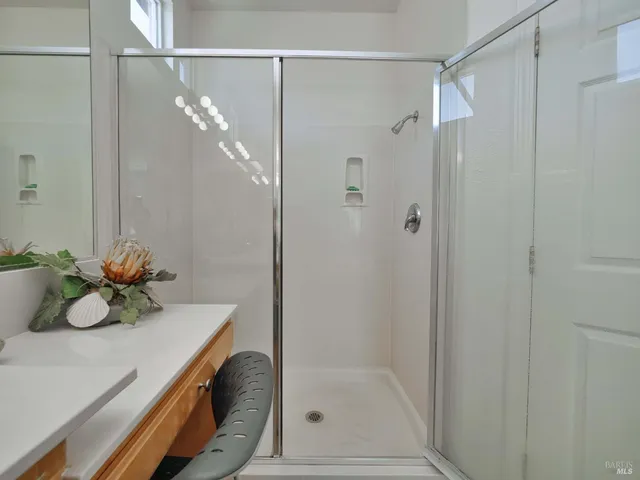 a bath room with a bath tub and shower