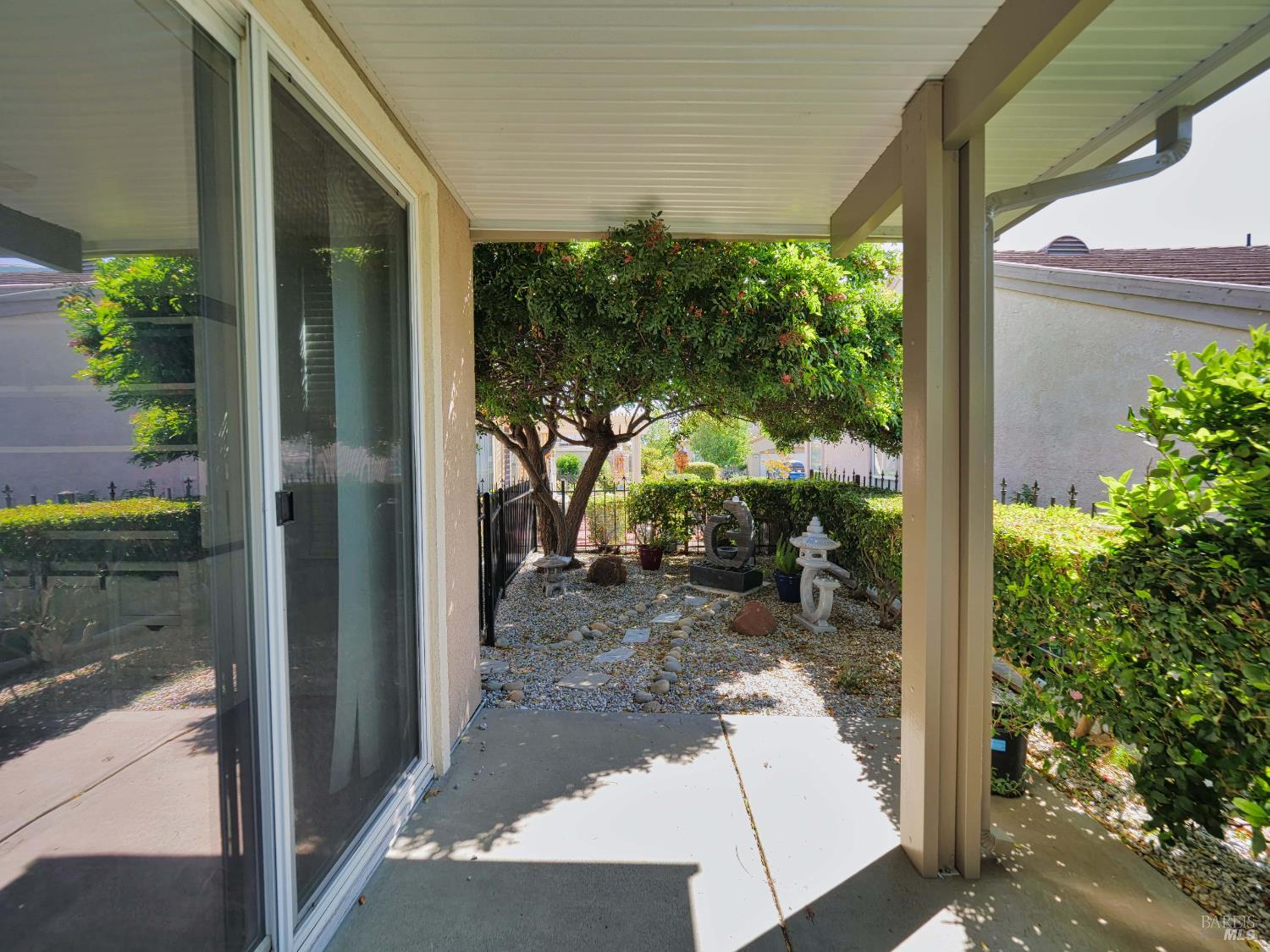 659 Pinehurst Drive, Unit CA Rio Vista, CA 94571 - Photo 26 of 40 a view of a porch with chairs and potted plants