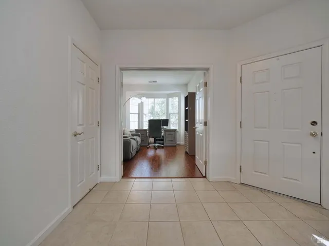 a view of a livingroom with furniture and an entryway