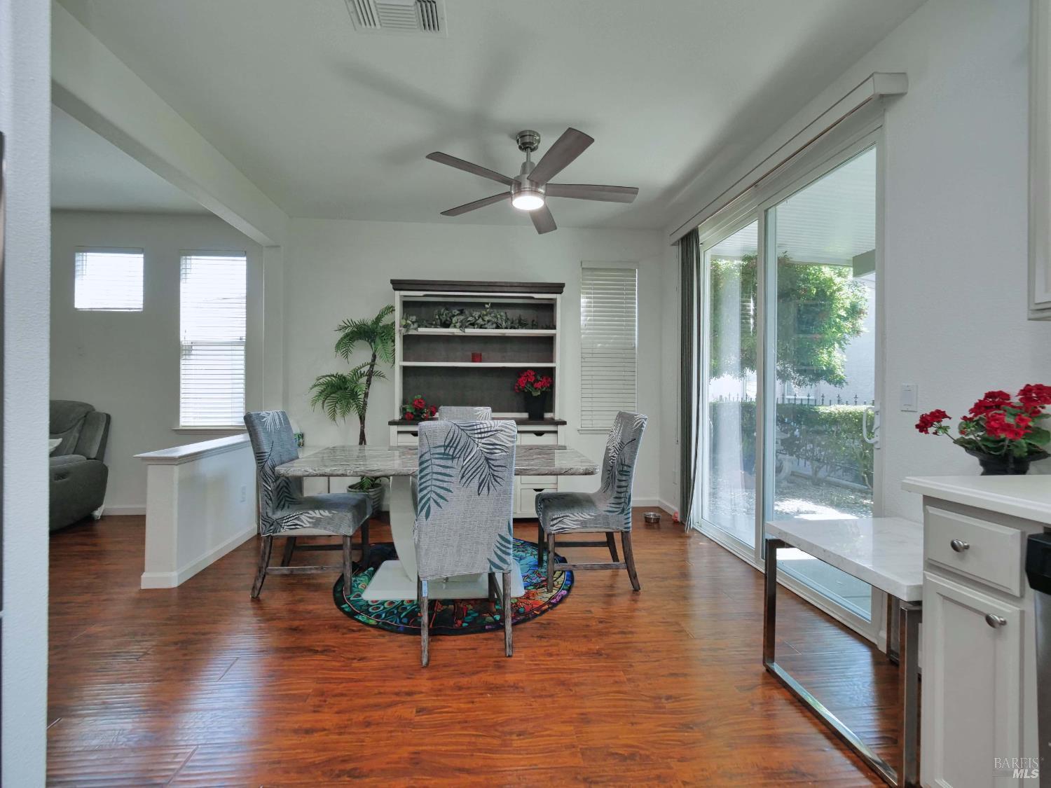 659 Pinehurst Drive, Unit CA Rio Vista, CA 94571 - Photo 10 of 40 a view of a dining room with furniture window and wooden floor