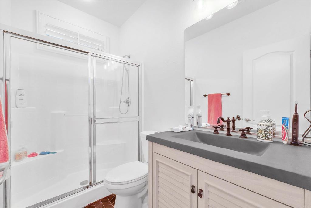 45418 Seagull Way Temecula, CA 92592 - Photo 14 of 31 a bathroom with a sink toilet and shower