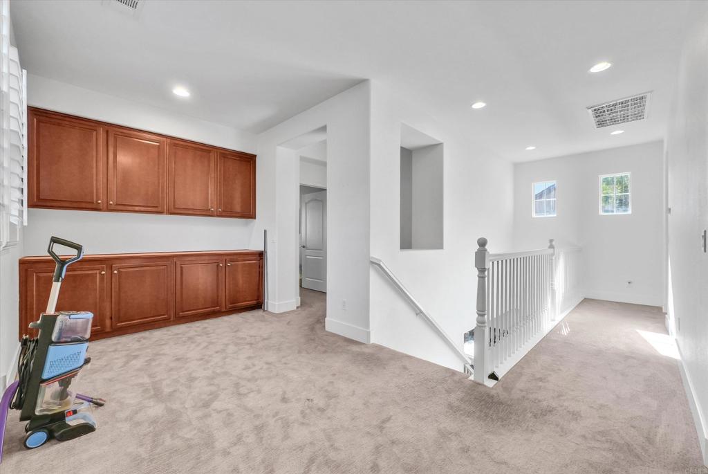 45418 Seagull Way Temecula, CA 92592 - Photo 20 of 31 a view of an empty room with a cabinet and stairs
