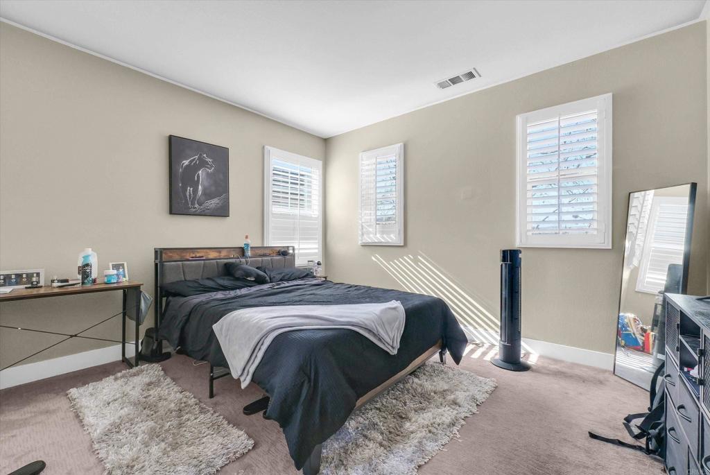 45418 Seagull Way Temecula, CA 92592 - Photo 24 of 31 a bedroom with a bed and a flat screen tv