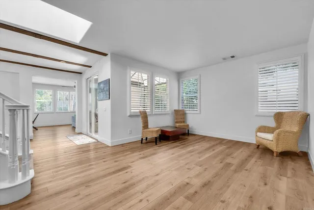 a view of a livingroom with furniture and wooden floor