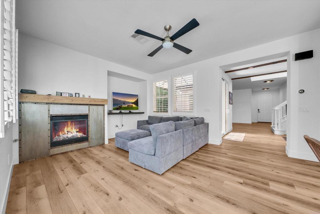45418 Seagull Way Temecula, CA 92592 - Photo 8 of 31 a living room with furniture and a fireplace
