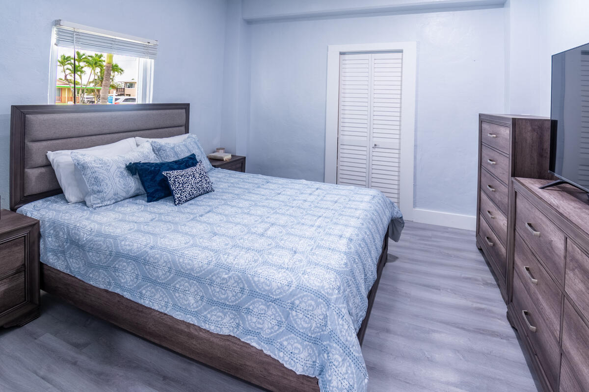 576 Coconut Avenue Goodland, FL 34140 - Photo 17 of 38 a bedroom with a bed and a window