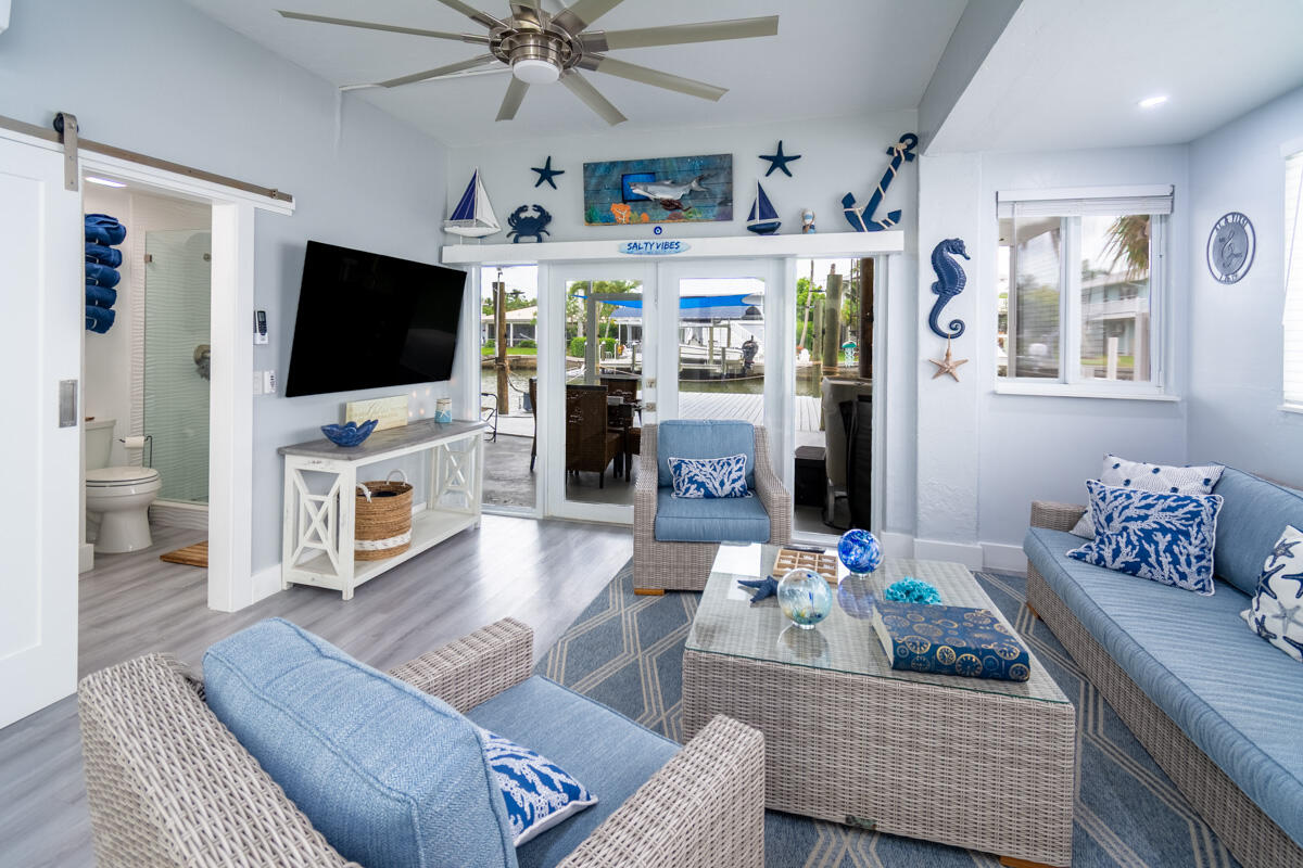 576 Coconut Avenue Goodland, FL 34140 - Photo 20 of 38 a living room with furniture and a flat screen tv