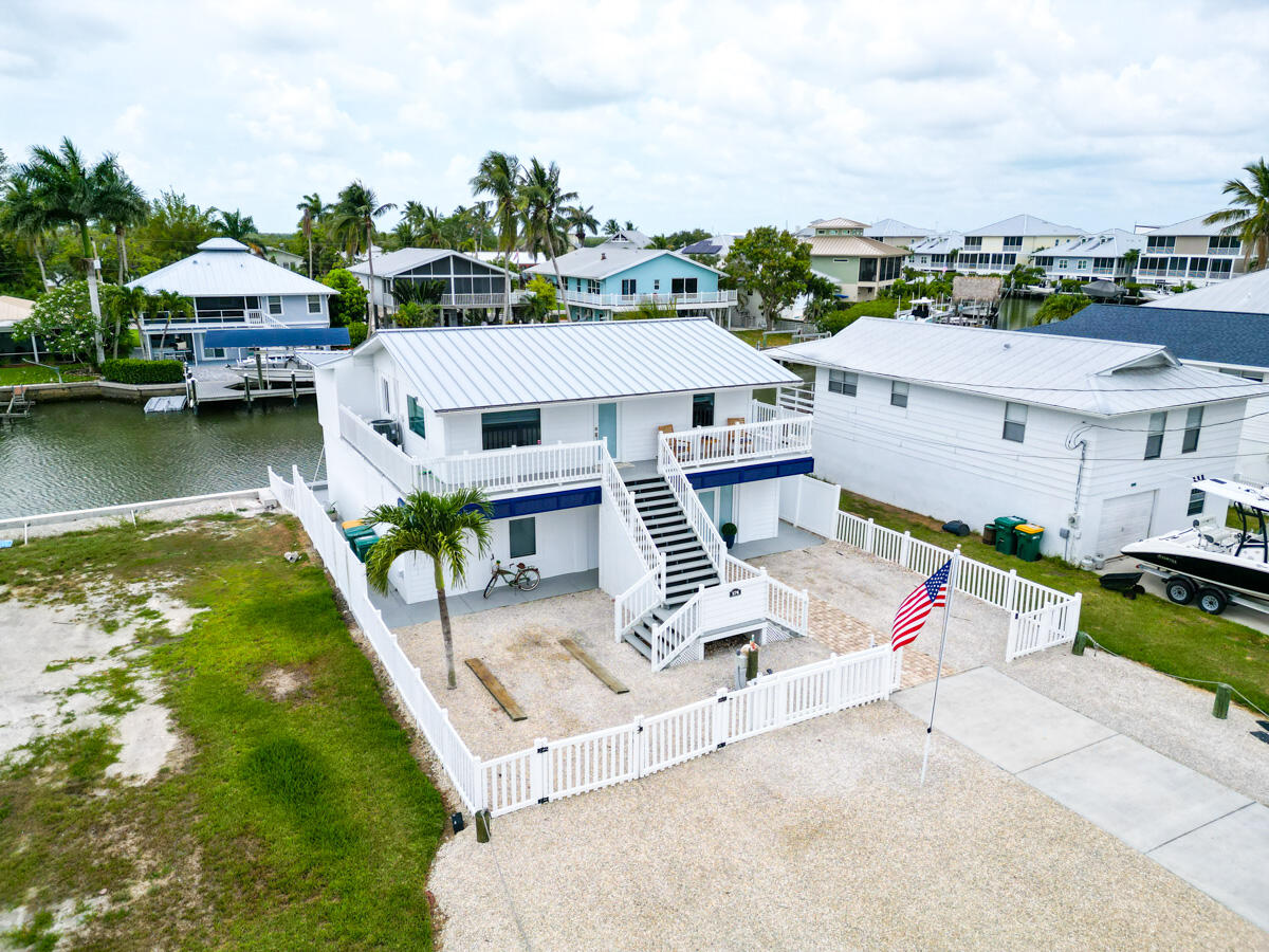 576 Coconut Avenue Goodland, FL 34140 - Photo 23 of 38 an aerial view of a house with a garden and lake view