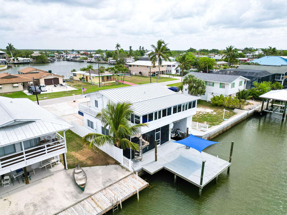576 Coconut Avenue Goodland, FL 34140 - Photo 31 of 38 an aerial view of a house with lake view