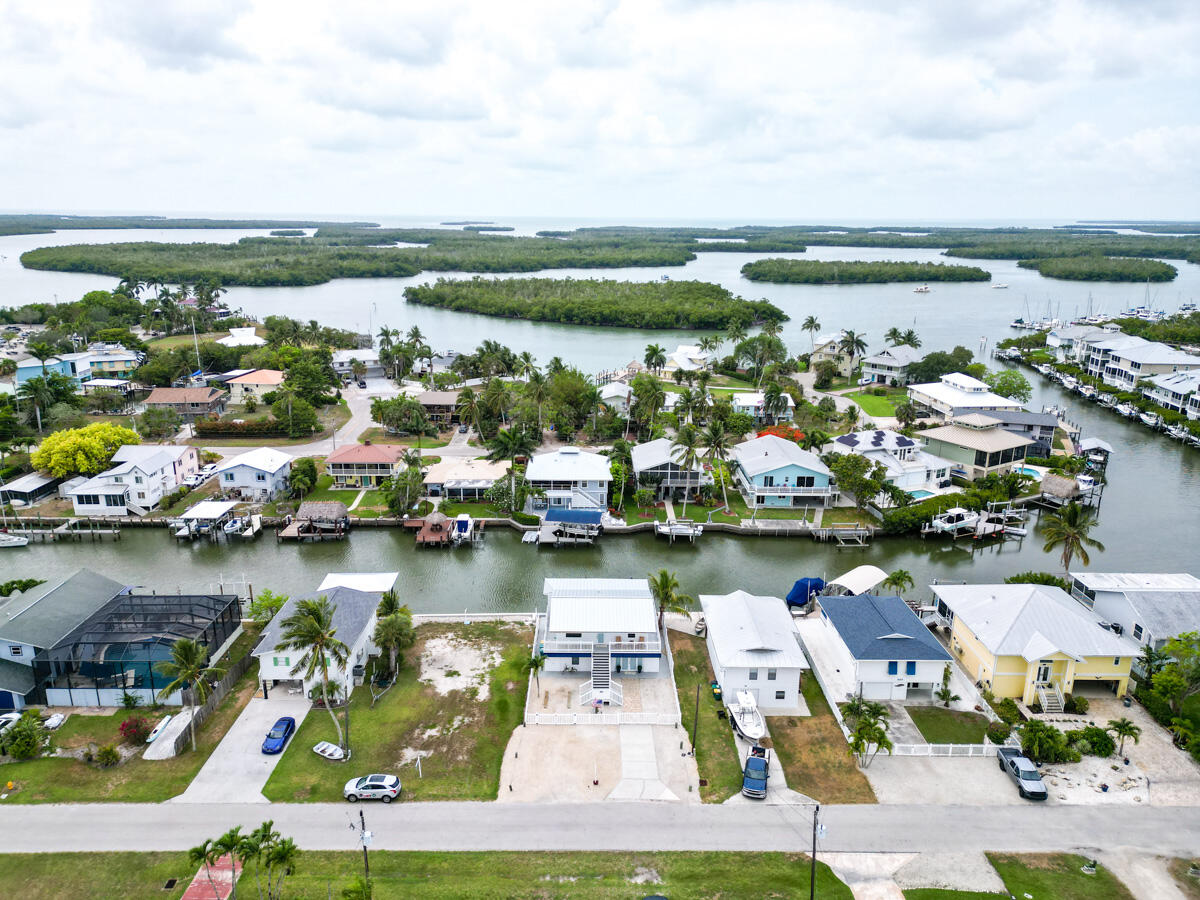576 Coconut Avenue Goodland, FL 34140 - Photo 32 of 38 an aerial view of water body with boats and residential houses with outdoor space