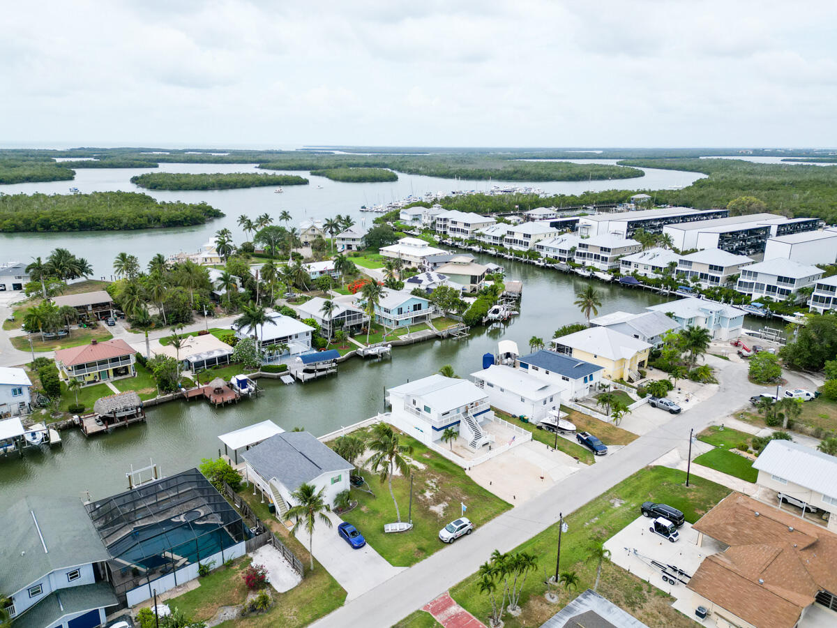576 Coconut Avenue Goodland, FL 34140 - Photo 34 of 38 an aerial view of a house with a lake view