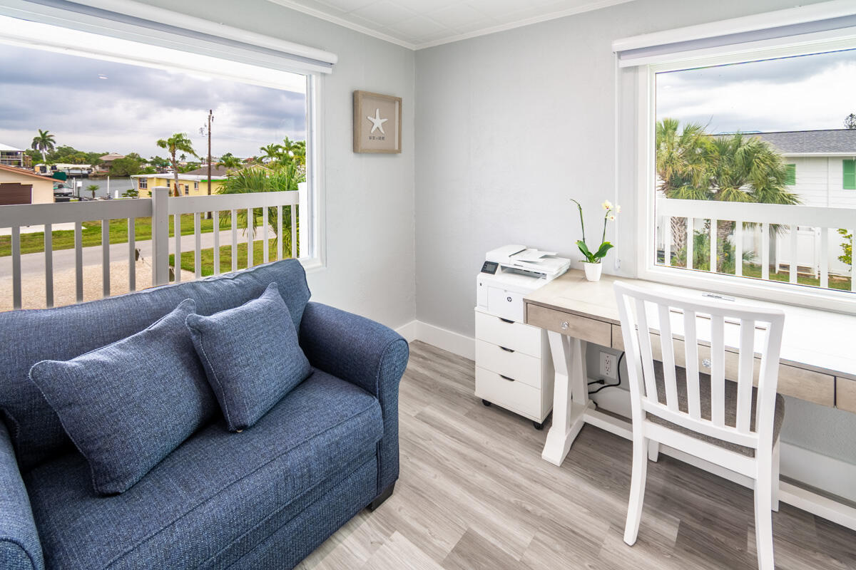 576 Coconut Avenue Goodland, FL 34140 - Photo 10 of 38 a living room with furniture and a large window