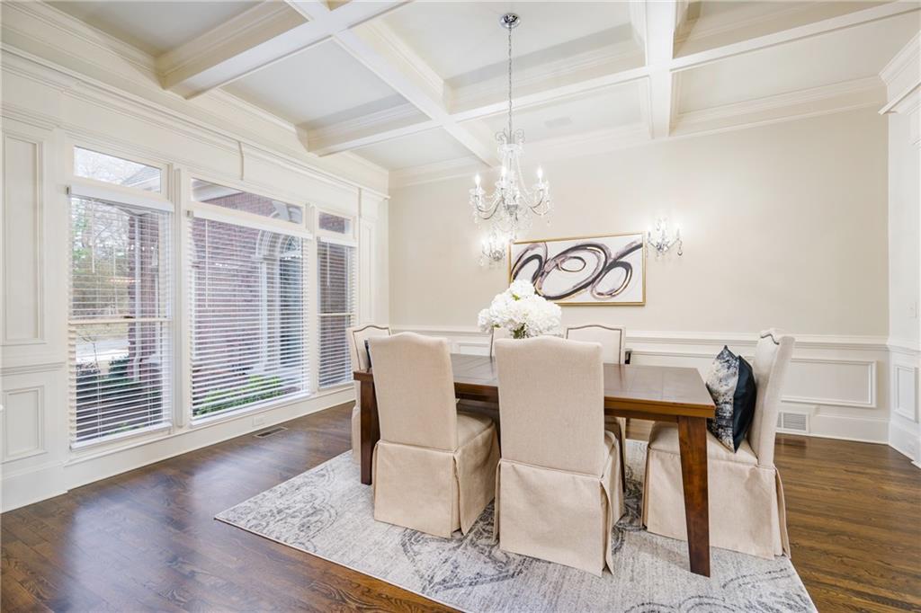 2760 Sugarloaf Club Drive Duluth, GA 30097 - Photo 12 of 67 a view of a dining room with furniture wooden floor and chandelier