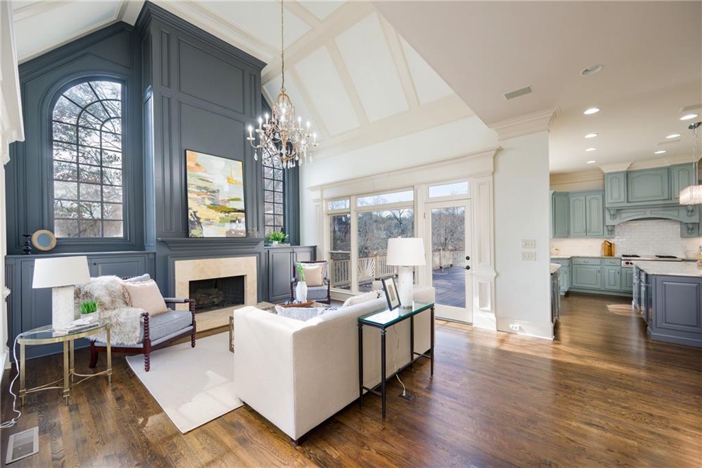 2760 Sugarloaf Club Drive Duluth, GA 30097 - Photo 21 of 67 a living room with furniture fireplace and a large window