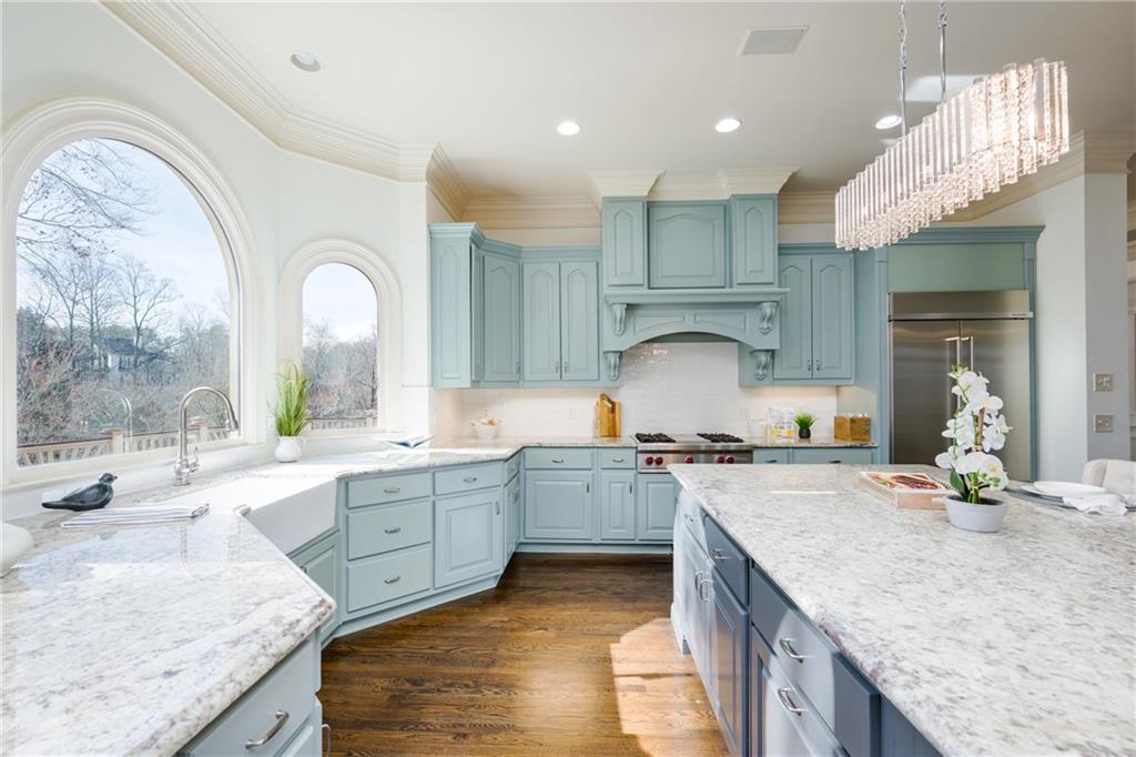 2760 Sugarloaf Club Drive Duluth, GA 30097 - Photo 22 of 67 a kitchen with sink stove and cabinets