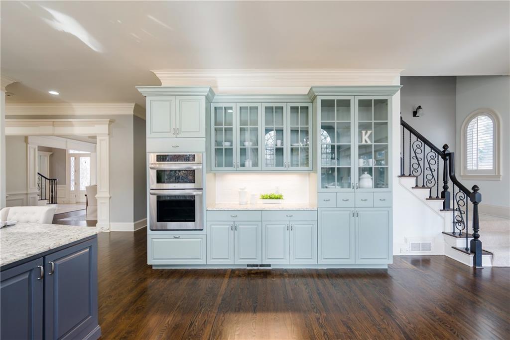 2760 Sugarloaf Club Drive Duluth, GA 30097 - Photo 23 of 67 a view of a kitchen with wooden floor and a sink