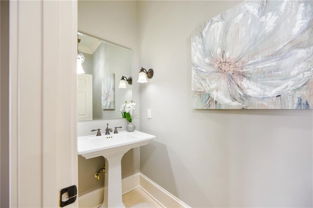 2760 Sugarloaf Club Drive Duluth, GA 30097 - Photo 26 of 67 a bathroom with a sink mirror and vanity