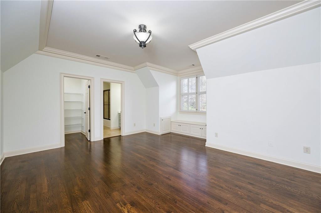 2760 Sugarloaf Club Drive Duluth, GA 30097 - Photo 36 of 67 a view of an empty room with wooden floor and a window