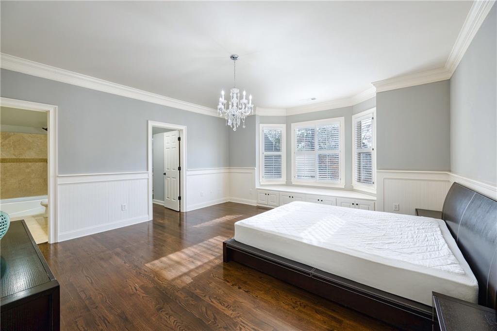 2760 Sugarloaf Club Drive Duluth, GA 30097 - Photo 40 of 67 a spacious bedroom with a bed and a window