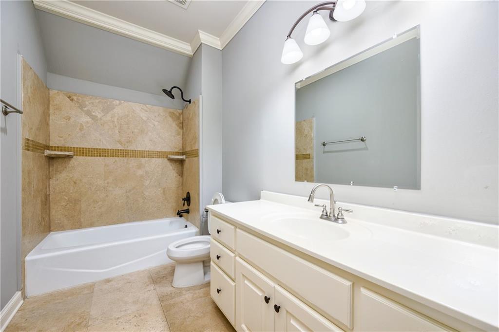 2760 Sugarloaf Club Drive Duluth, GA 30097 - Photo 41 of 67 a bathroom with a sink a toilet and shower