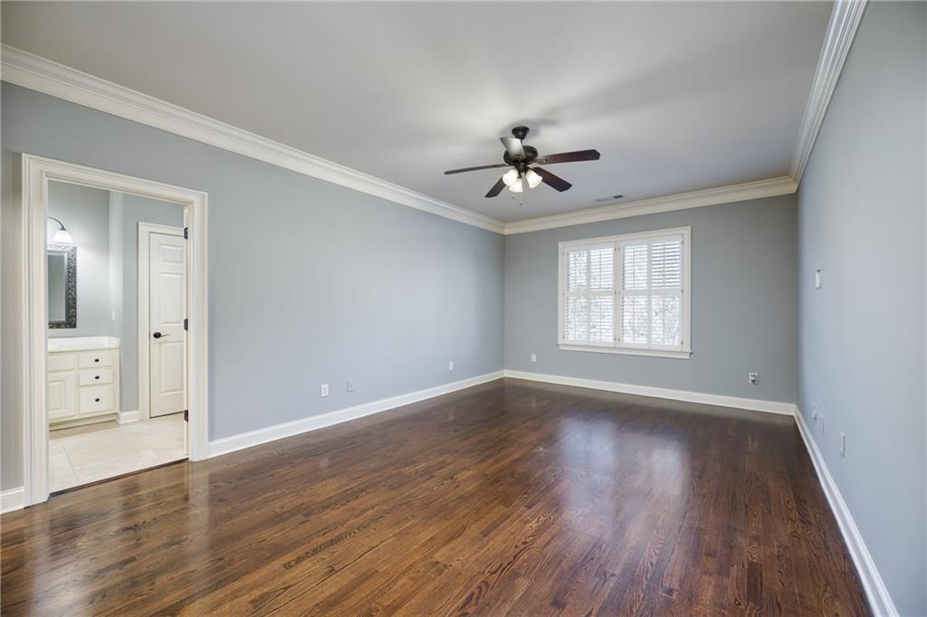 2760 Sugarloaf Club Drive Duluth, GA 30097 - Photo 44 of 67 a view of an empty room with a window and wooden floor