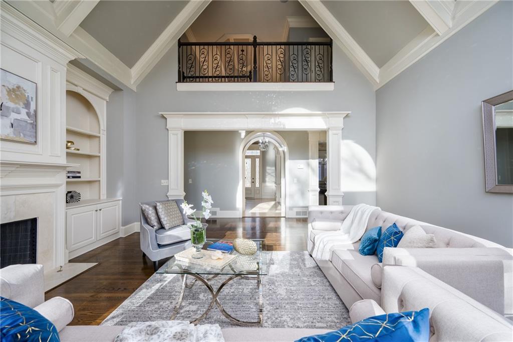 2760 Sugarloaf Club Drive Duluth, GA 30097 - Photo 63 of 67 a living room with furniture and a fireplace