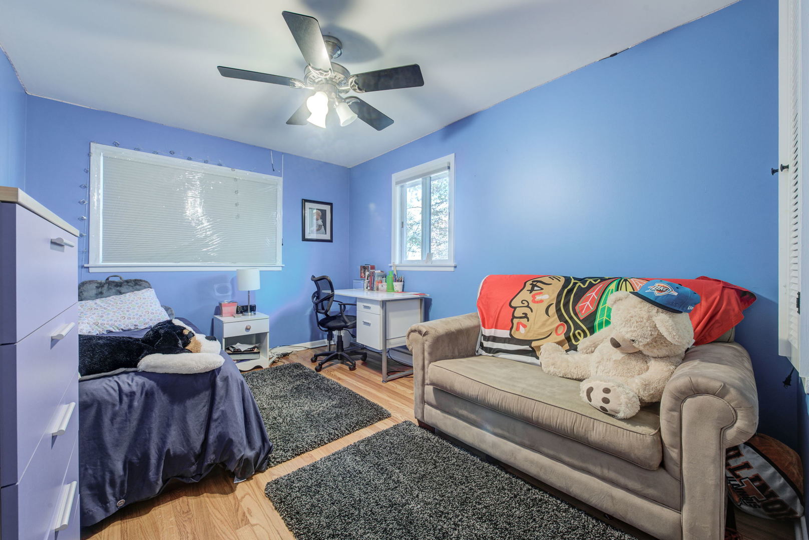 1251 Kenton Road Deerfield, IL 60015 - Photo 17 of 36 a living room with furniture and a ceiling fan