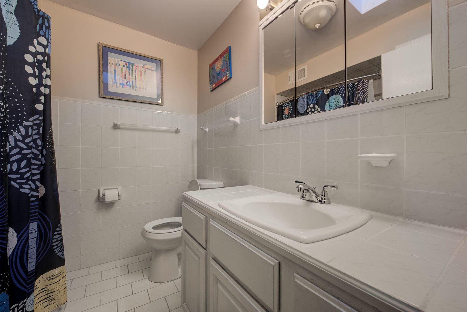 1251 Kenton Road Deerfield, IL 60015 - Photo 21 of 36 a bathroom with a sink and a toilet