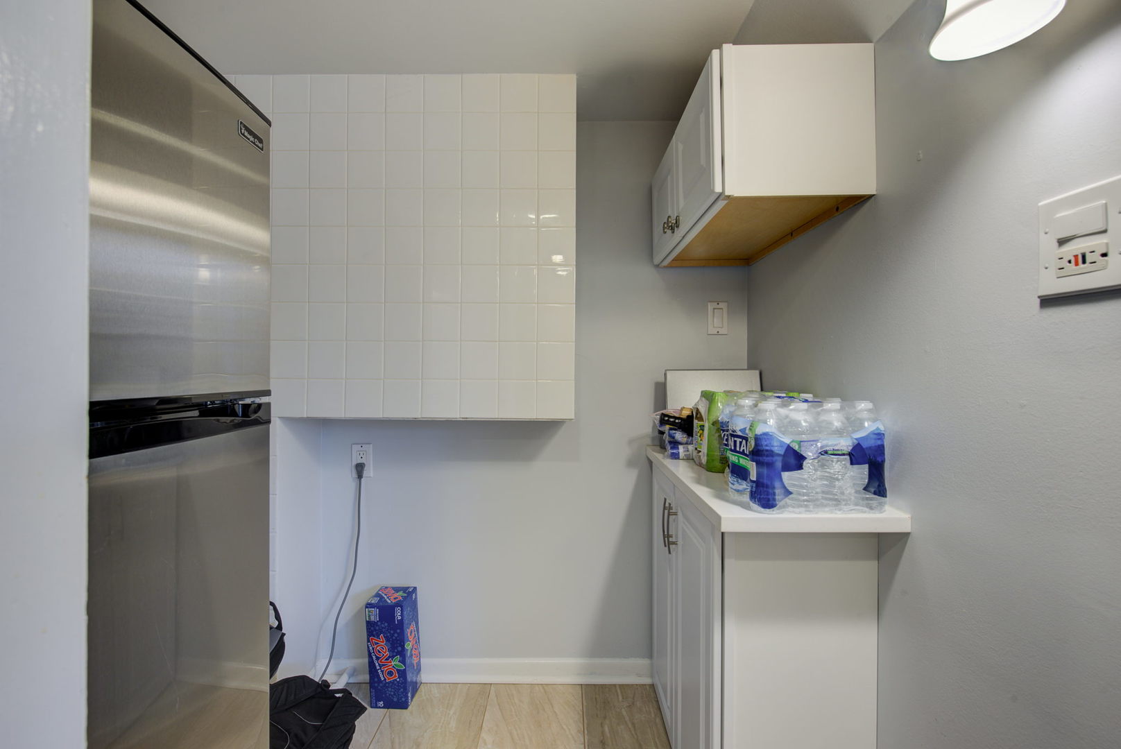 1251 Kenton Road Deerfield, IL 60015 - Photo 23 of 36 a kitchen with a sink and cabinets