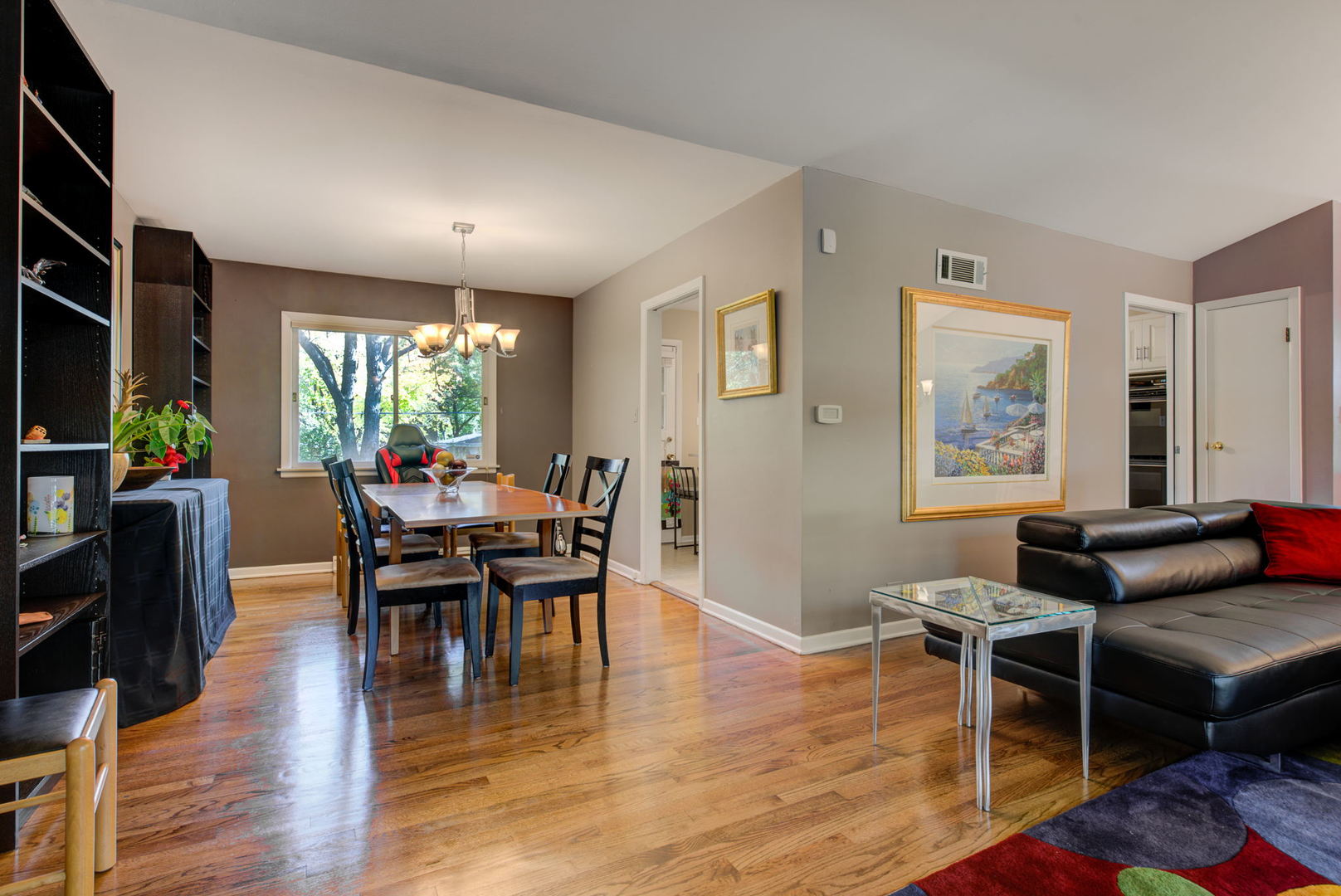 1251 Kenton Road Deerfield, IL 60015 - Photo 4 of 36 a view of a dining room with furniture and wooden floor