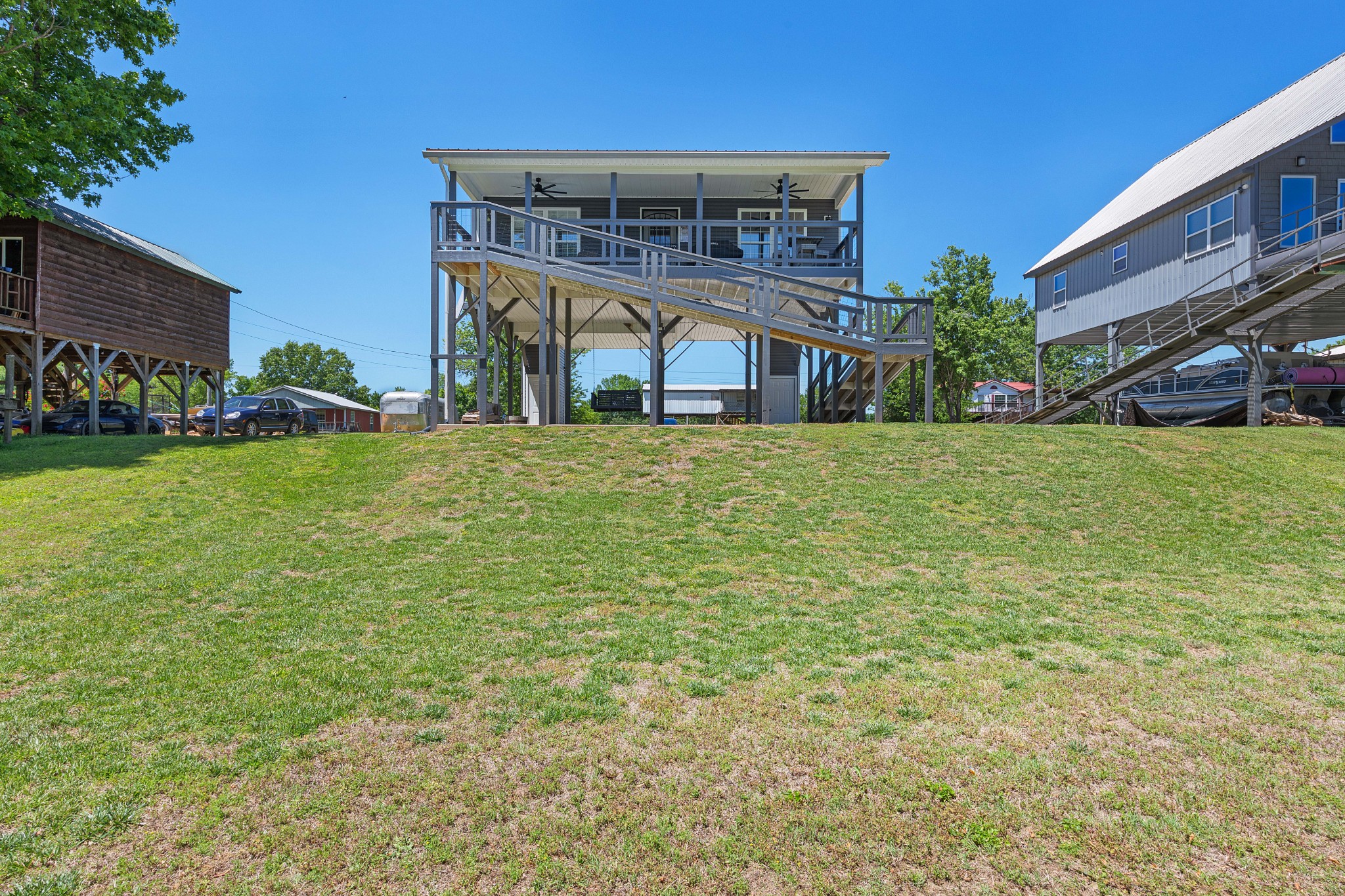 958 Pevahouse Camp Lane Decaturville, TN 38329 - Photo 20 of 32 a front view of a house with a yard