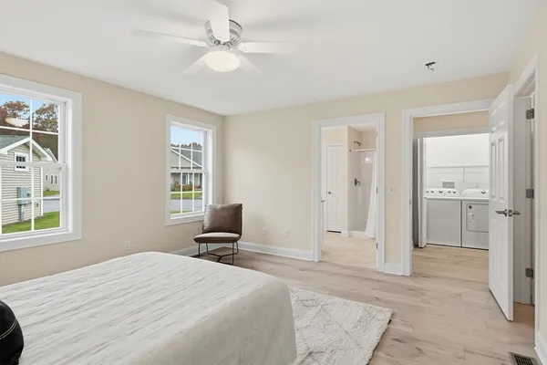 a bed room with a bed and a window