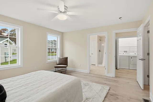 a bed room with a bed and a window