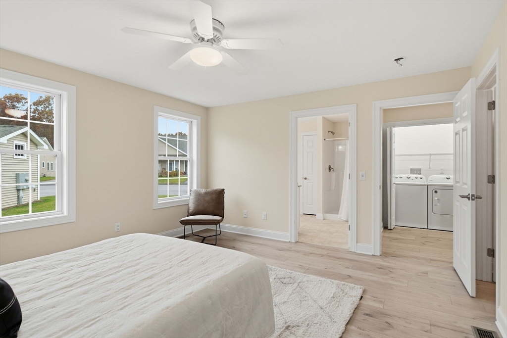 32 Lodge Lane, Unit 32 Wilbraham, MA 01095 - Photo 19 of 42 a bed room with a bed and a window