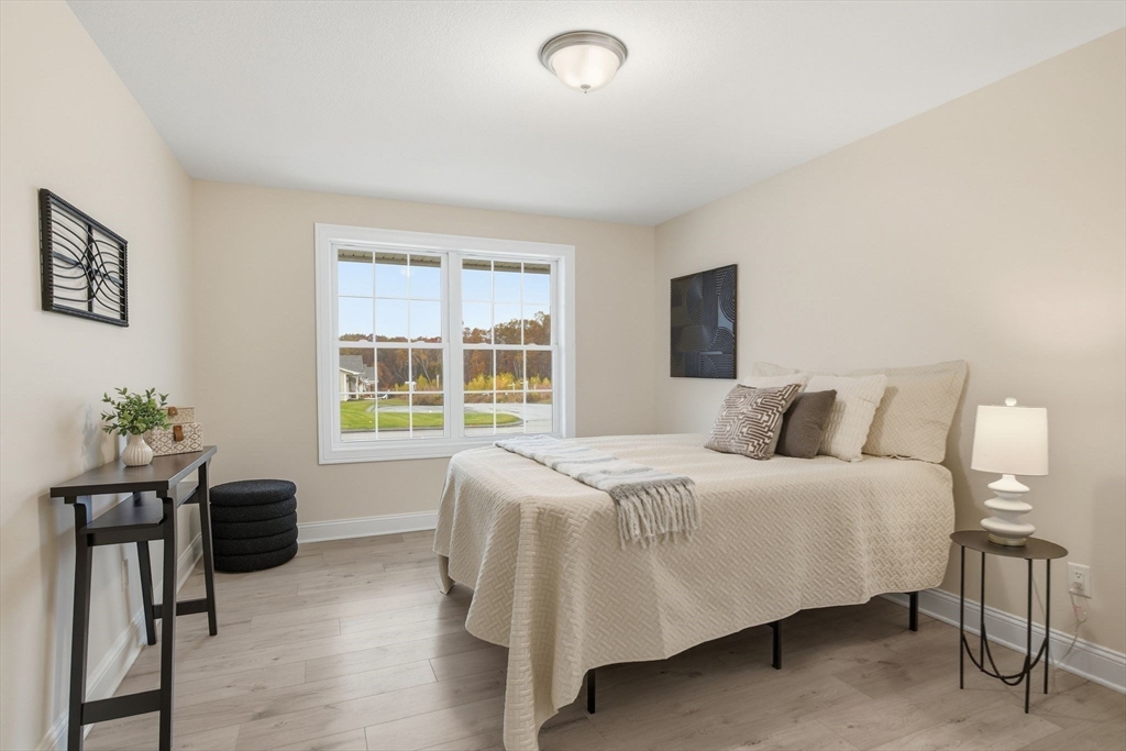 32 Lodge Lane, Unit 32 Wilbraham, MA 01095 - Photo 24 of 42 a bedroom with a bed and a window