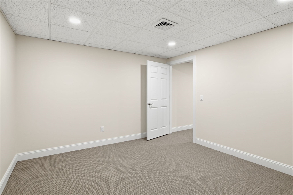 32 Lodge Lane, Unit 32 Wilbraham, MA 01095 - Photo 32 of 42 an empty room with a empty space and windows