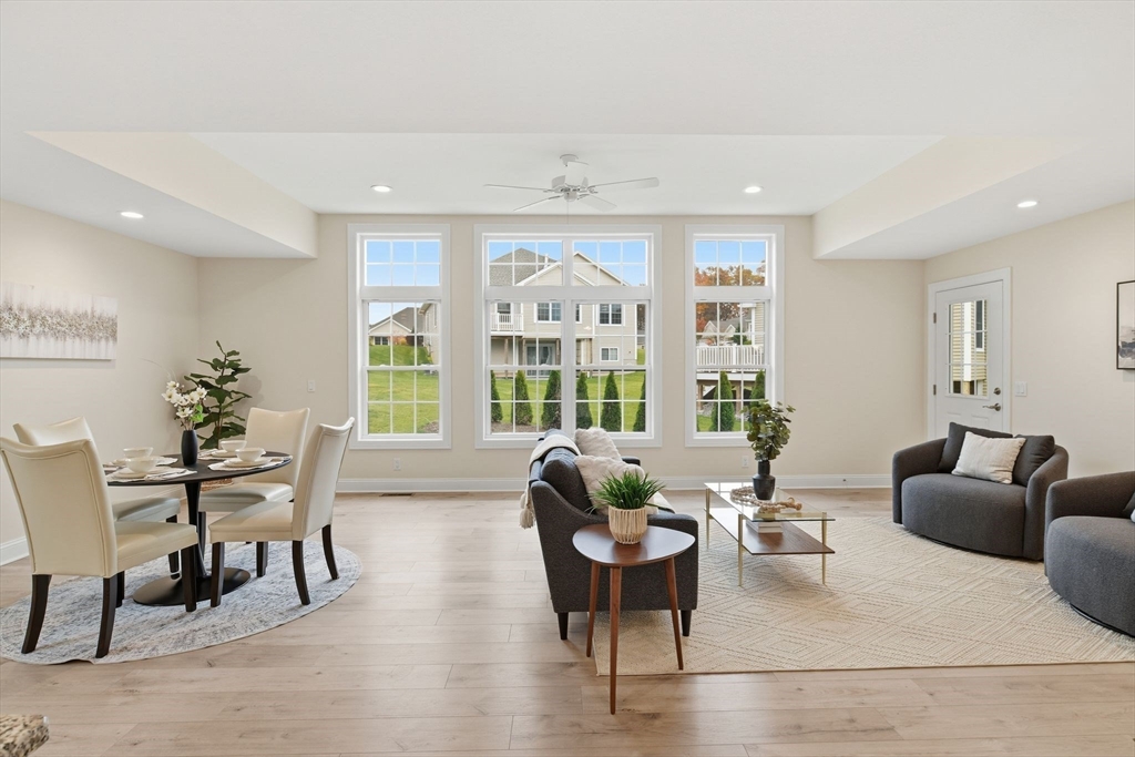 32 Lodge Lane, Unit 32 Wilbraham, MA 01095 - Photo 5 of 42 a living room with furniture and a large window