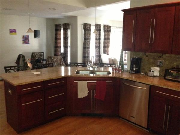 222 Perry Hill Road Acushnet, MA 02743 - Photo 5 of 13 a kitchen with a sink and cabinets