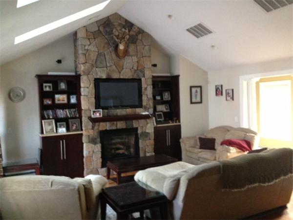222 Perry Hill Road Acushnet, MA 02743 - Photo 7 of 13 a living room with furniture and a flat screen tv