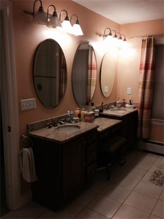 222 Perry Hill Road Acushnet, MA 02743 - Photo 9 of 13 a bathroom with a double vanity sink and a mirror