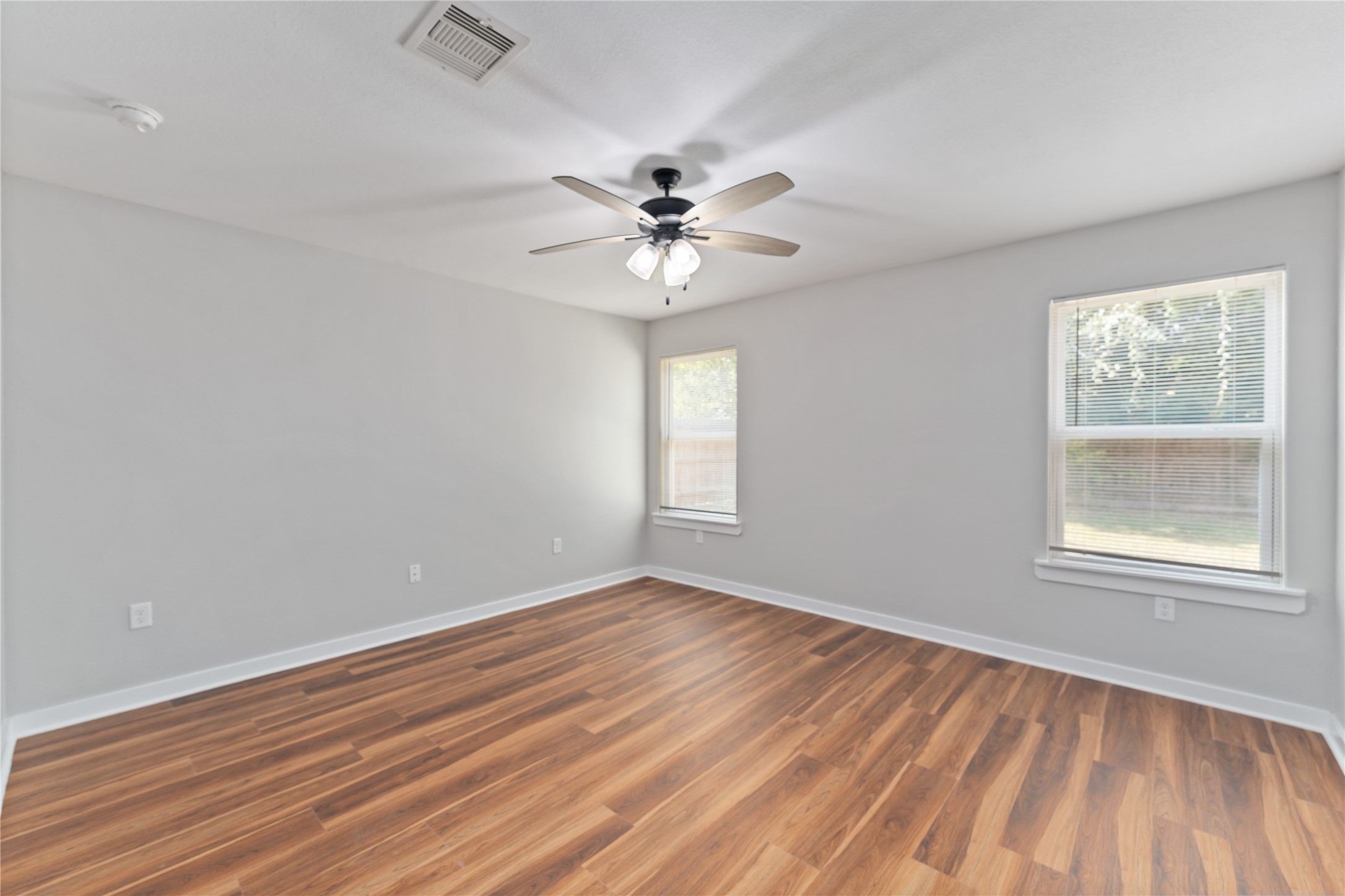 8617 Clarington Street Houston, TX 77016 - Photo 13 of 25 wooden floor in an empty room with a window