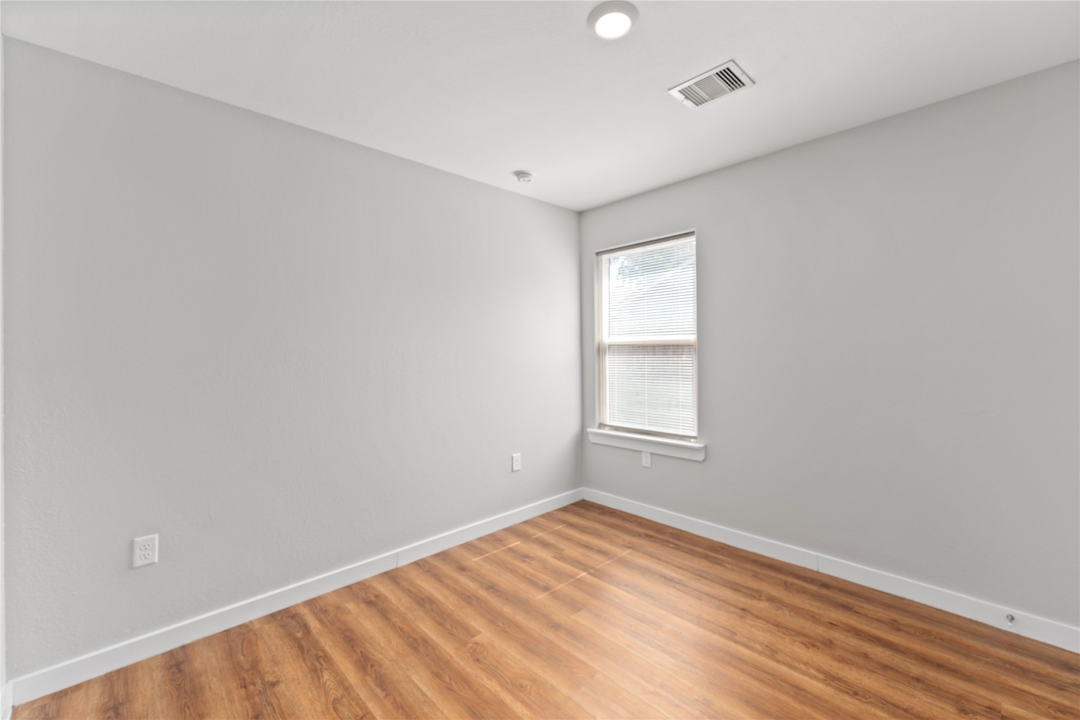 8617 Clarington Street Houston, TX 77016 - Photo 21 of 25 an empty room with a window