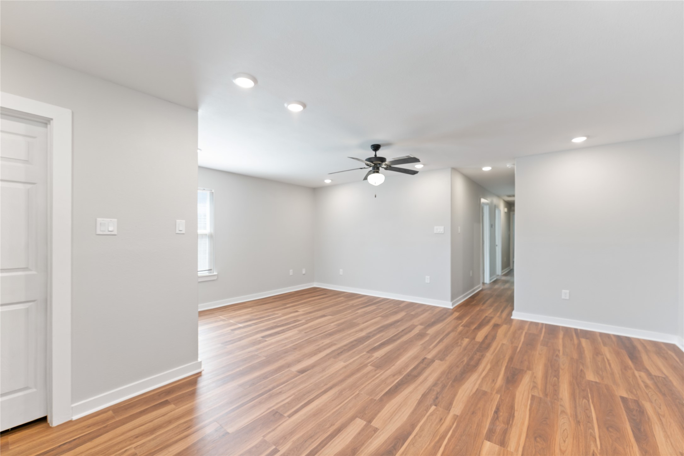8617 Clarington Street Houston, TX 77016 - Photo 8 of 25 a view of empty room with wooden floor