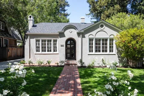 a front view of a house with garden