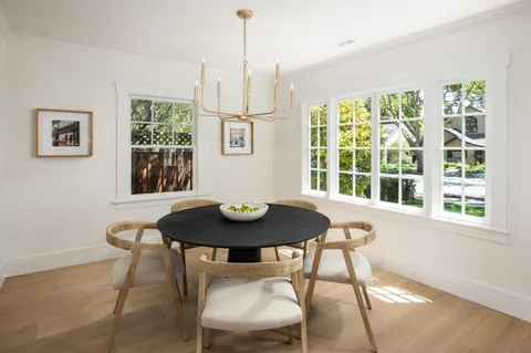 a view of a dining room with furniture and window
