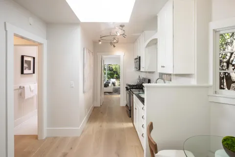 a view of a kitchen from the hallway