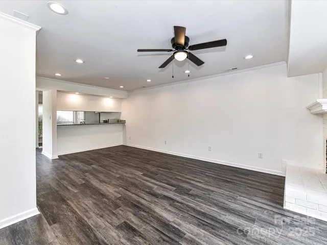 a view of a kitchen counter top space and a ceiling fan